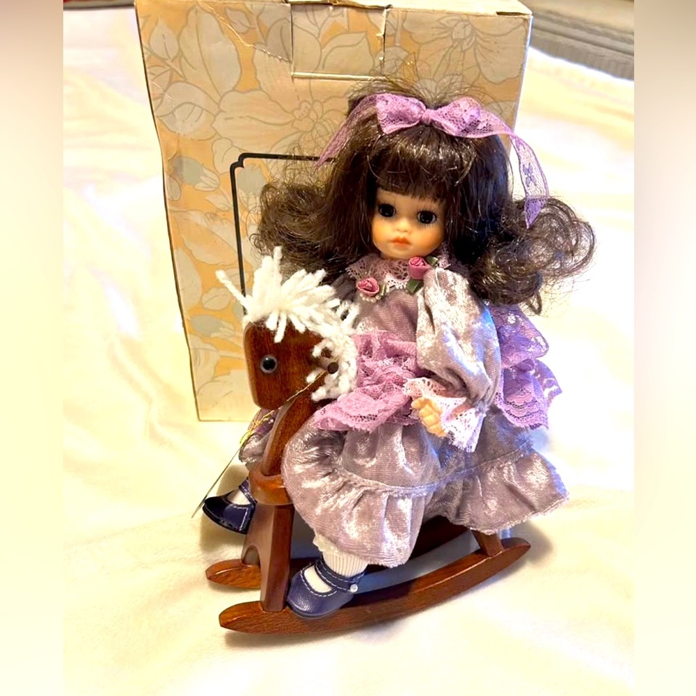 Charming porcelain collectible Doll with Rocking Horse